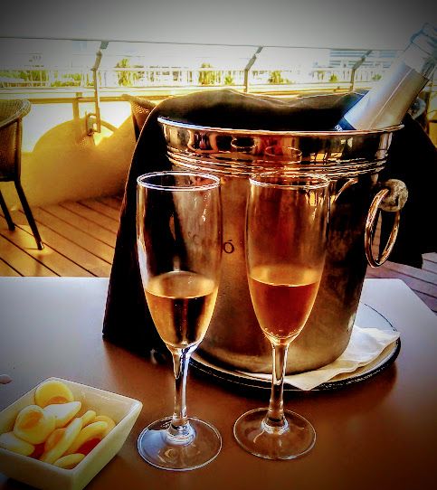 Pink cava on a rooftop overlooking the port of Barcelona